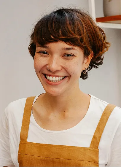 Portrait of Sarah Johnson on a sunlit deck