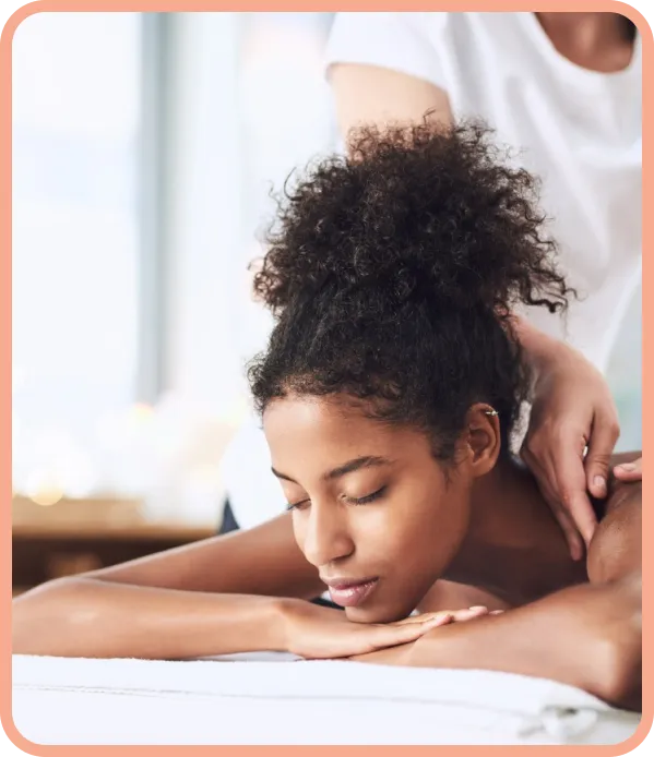 Gentle Lomi Lomi hands-on bodywork in a warm, nurturing treatment environment