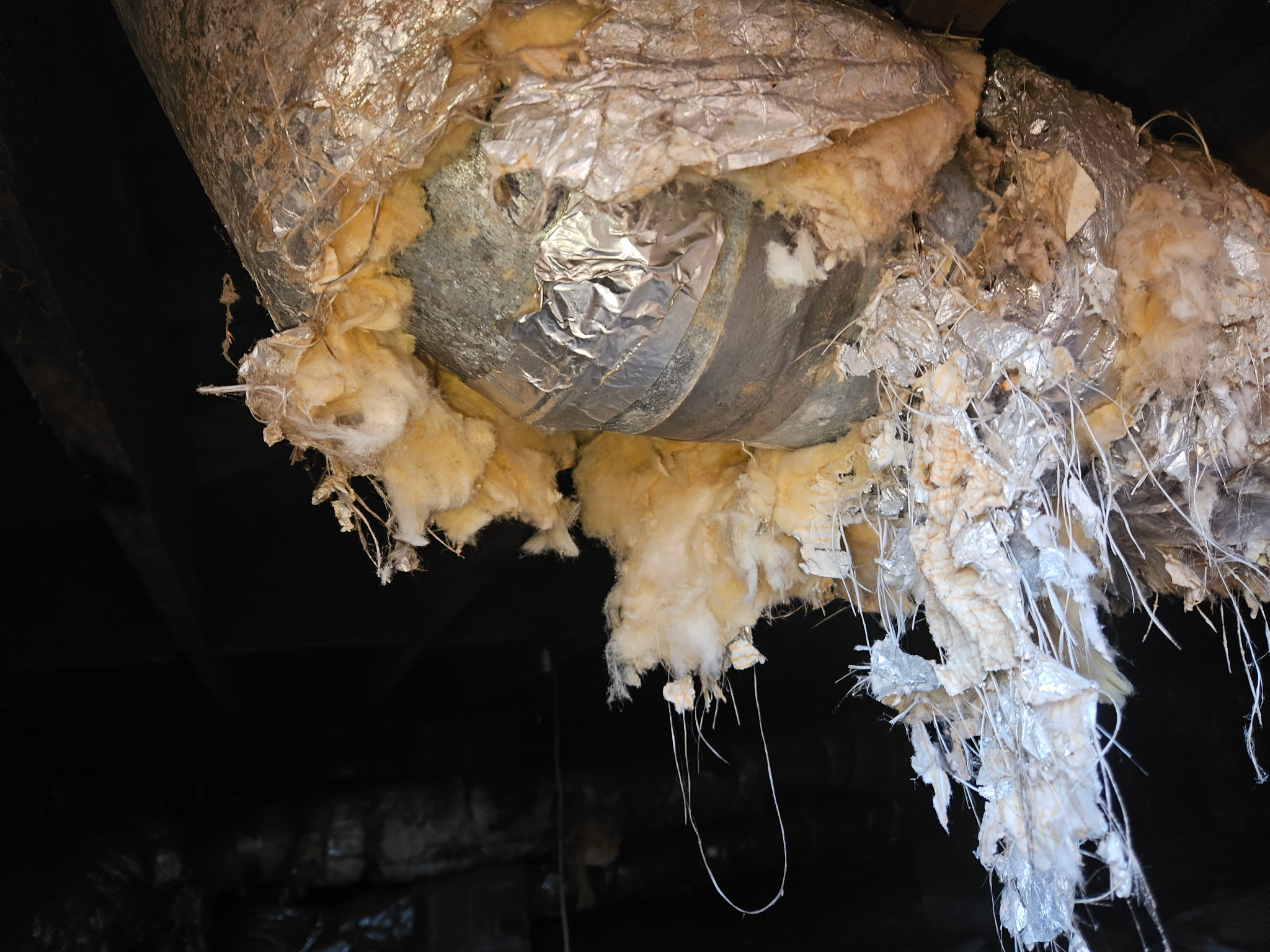 Residential HVAC system and insulated ductwork in crawlspace prior to duct replacement