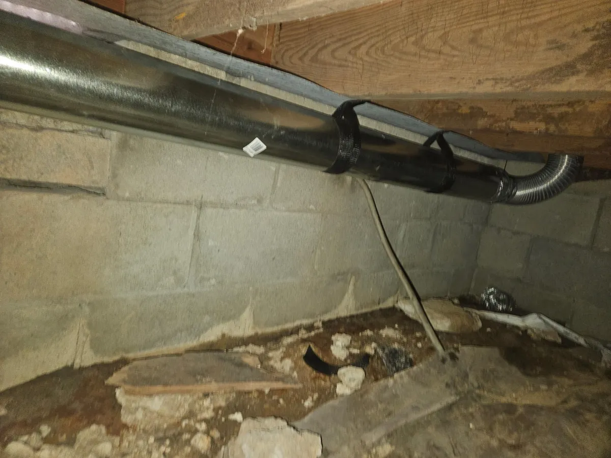 Long dryer vent run in crawlspace causing poor airflow and lint accumulation in Memphis Tennessee home