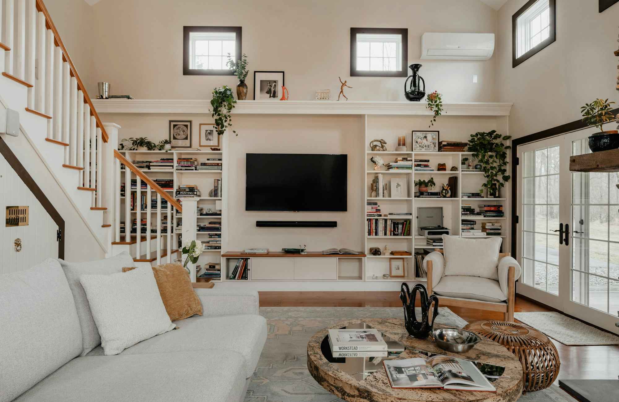 straighten-up-homes-manhattan-beach-ca-hidden-message-behind-clutter-living-room-with-high-ceilings-built-in-cabinets-staircase-simplify