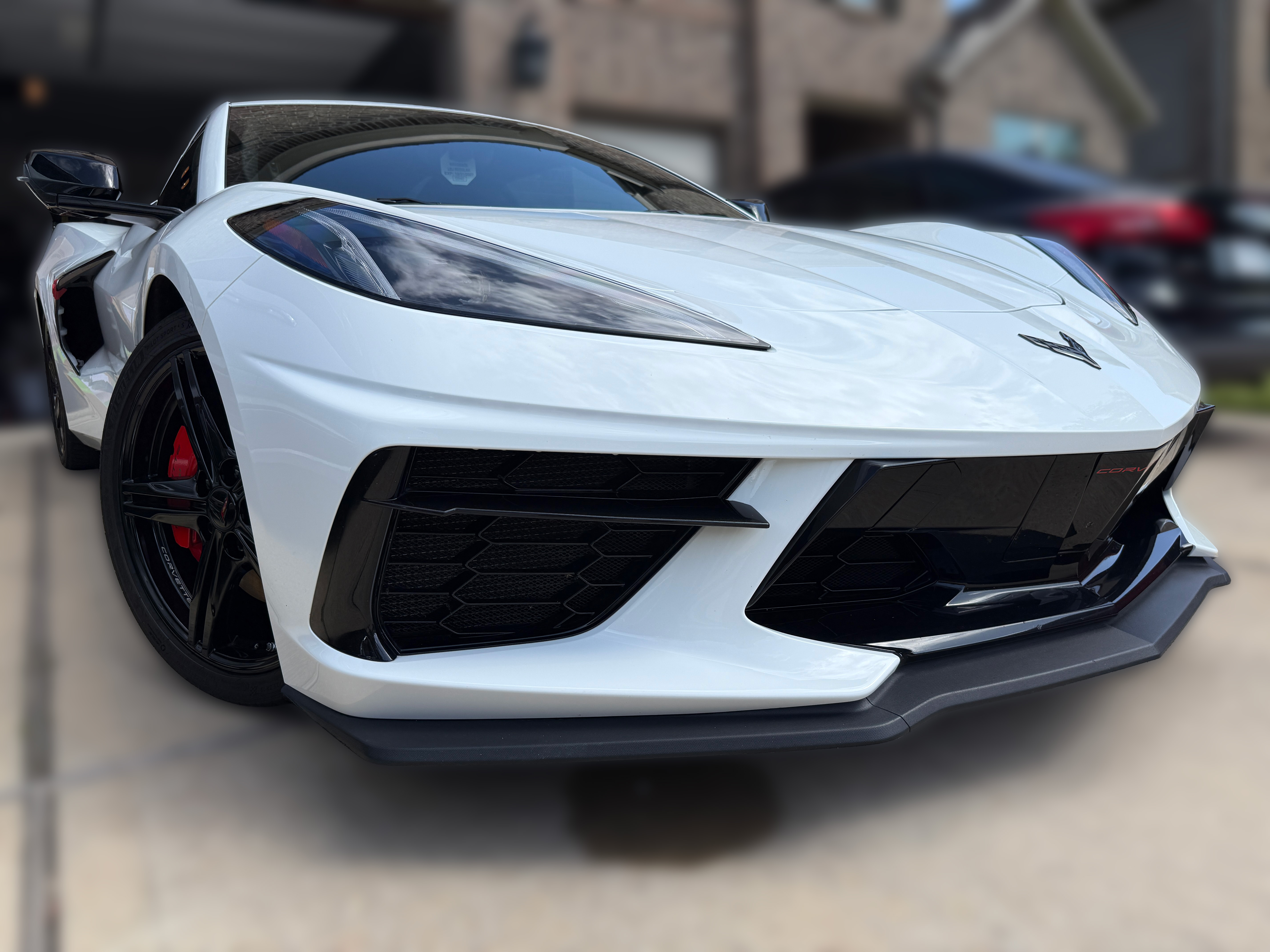 Freshly detailed white Corvette with a mirror gloss finish