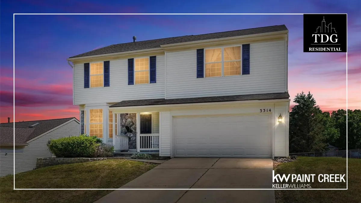 Well-maintained Millpointe home for sale at 3314 Valley Rise Dr in Holly Michigan with dramatic two-story great room, fenced backyard, and recently replaced roof, furnace, and A/C listed by The Delia Group