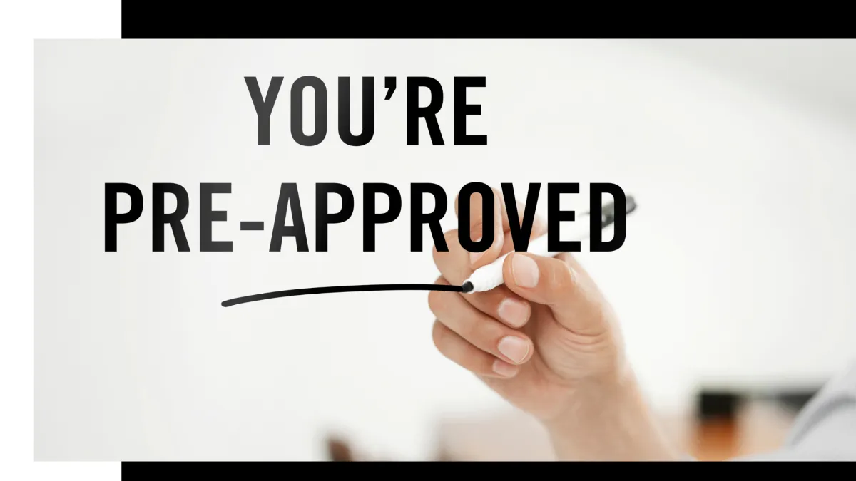 A Rochester, MI homebuyer reviewing mortgage paperwork with a lender, highlighting the difference between pre-approval and pre-qualification before starting a home search.