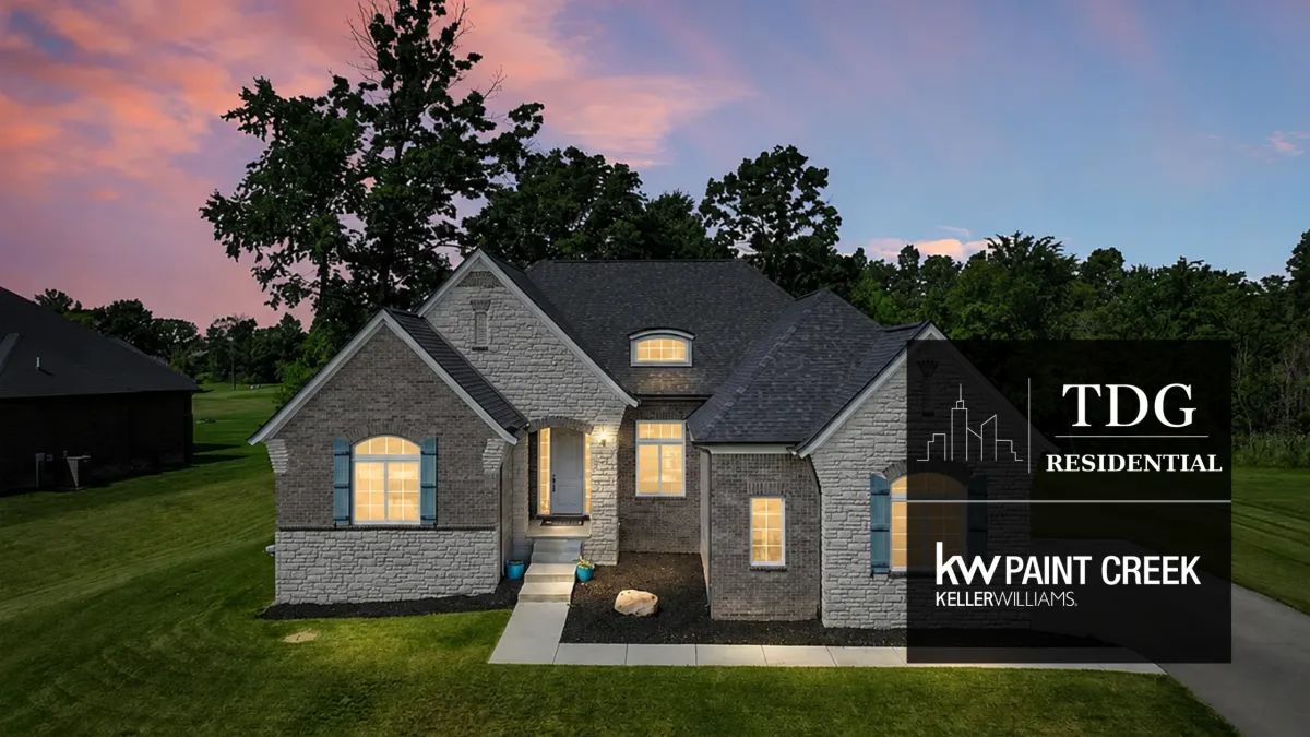 Luxury stone-and-brick estate for sale at 2100 Shane Ct, Oxford, MI 48370 in gated Copper Hills with fairway views, listed by The Delia Group.