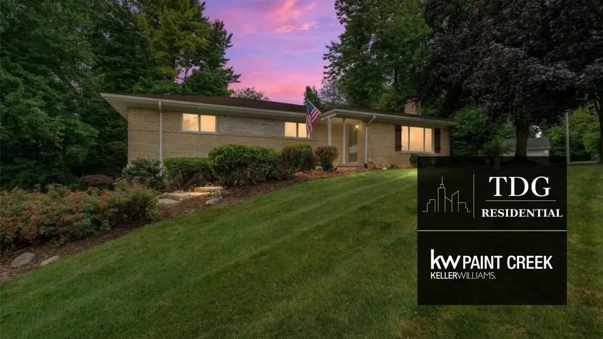 Beautifully maintained ranch for sale at 197 Perrydale St, Rochester Hills, MI 48306 on a picturesque tree-lined lot with a landscaped yard, listed by The Delia Group.