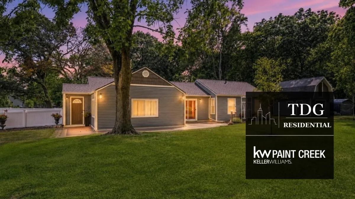 Updated ranch for sale at 423 East Rd, Holly, MI 48442 on 1.27 acres with Rice Lake views and mature trees, listed by The Delia Group.