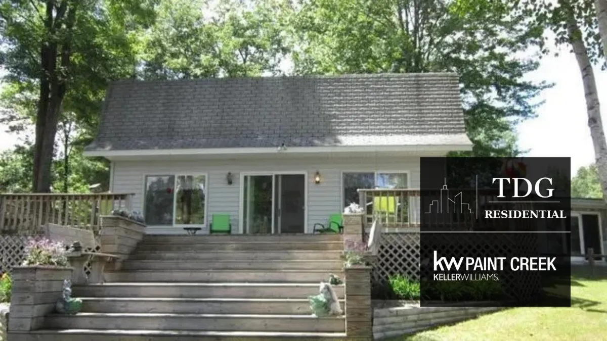 Turn-key waterfront canal home for sale at 3892 Thendara Ct, Gladwin, MI 48624 on Secord Lake with a lakeside deck and two docks, listed by The Delia Group.