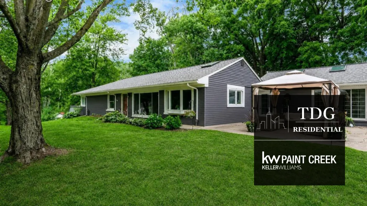 Contemporary turnkey ranch for sale at 340 Whims Ln, Rochester, MI 48306 on nearly two wooded acres with a walkout basement, listed by The Delia Group.