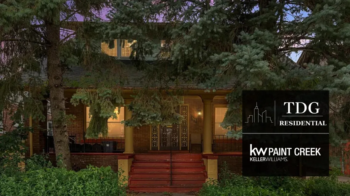 Historic 1915 Colonial for sale at 115 Moss St in Highland Park, Michigan, with original wood doors, hardwood floors, a coffered dining room, and deep covered porch.