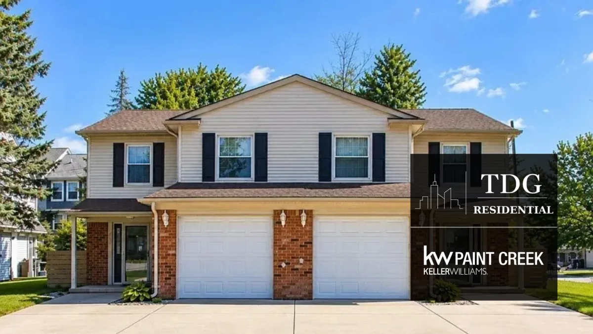 Troy duplex for sale at 5904-5906 Niles Rd with private decks and separate garages, presented by The Delia Group.