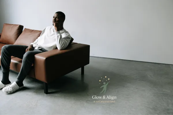 A calm leader sitting in a quiet office after hours, reflecting while pressure exists around them — symbolizing grounded stability under stress.