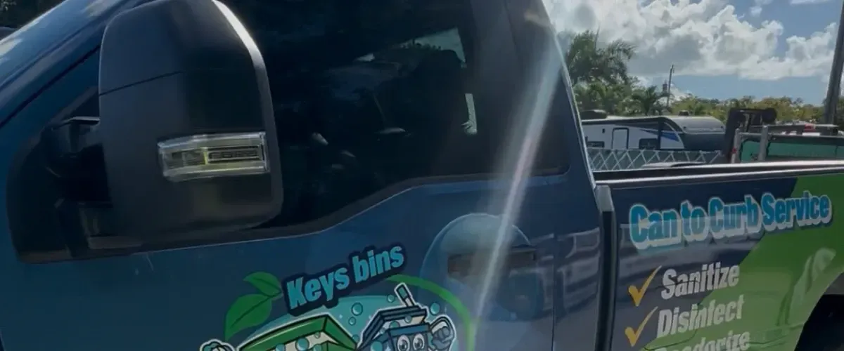 Side view of a trash bin cleaning truck with a service checklist and cartoon bin characters.