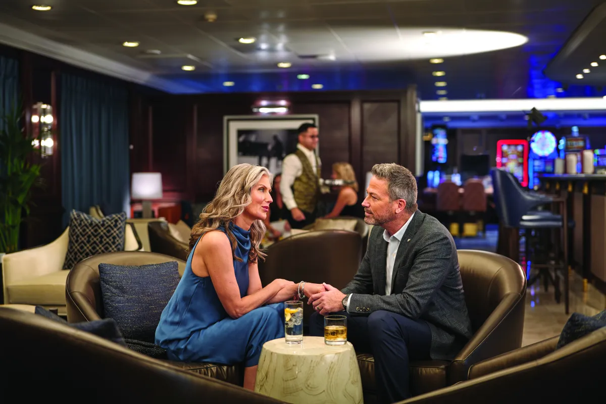 Oceania Cruise - couple having cocktails in one of the bars - luxury sassy cruises 