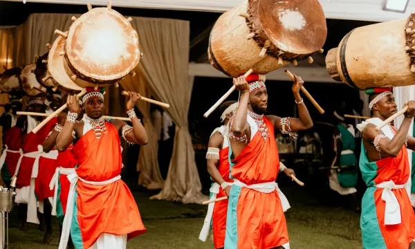 Dancers and musicians in cultural costume, drumming, at local festival scene - Africa Cruise - Luxury Sassy Cruises 