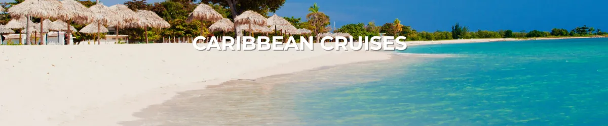 Tropical Caribbean beach with soft white sand, turquoise waters, and palm-thatched huts under a clear blue sky – banner for Caribbean cruises.