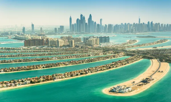 A breathtaking aerial view of Dubai’s iconic Palm Jumeirah and city skyline, symbolising modern luxury in the Middle East.