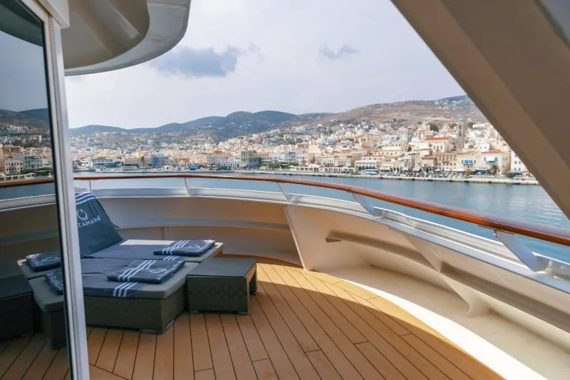 Large private balcony of Azamara Owner’s Suite with sun loungers, outdoor seating, and ocean views.
