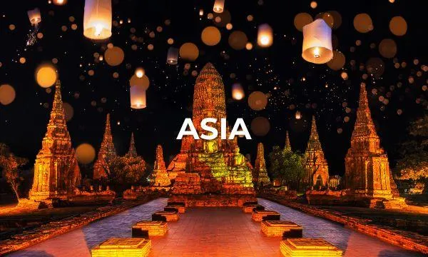 illuminated asian temple entrance with glowing lanterns and reflection pool on an azamara asia cruise