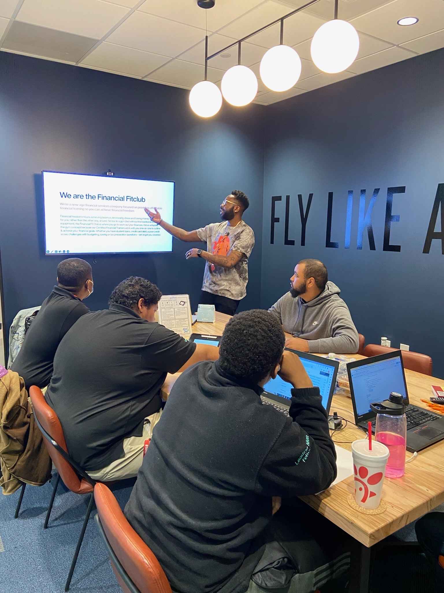 Financial Fit Club team presentation introducing mission and goals during business meeting