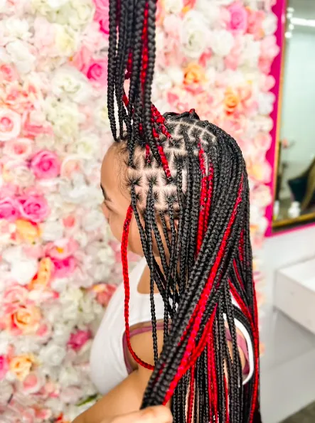 Square editorial image of a softly styled salon interior and a client smiling in a chair, natural tones, editorial crop emphasizing atmosphere and craftsmanship.