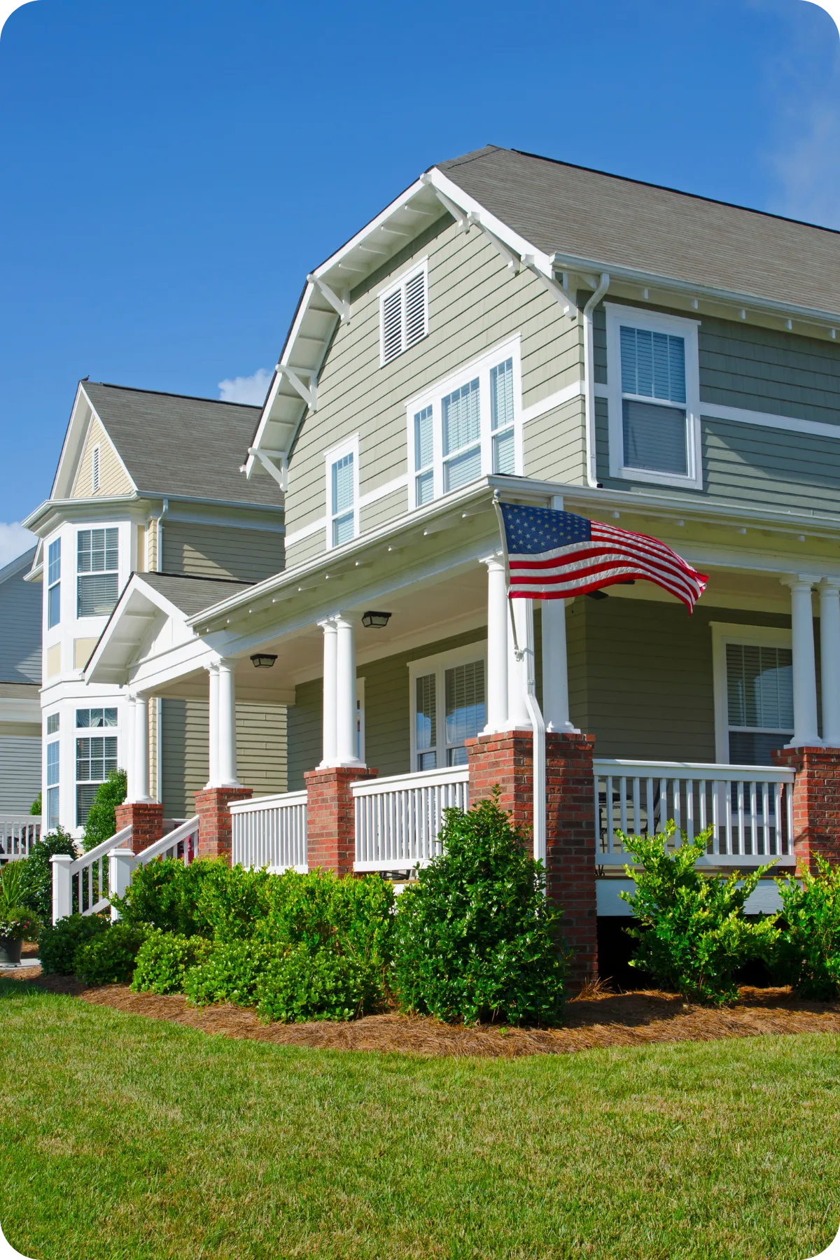 Front view of a well-maintained Orlando, FL home with American flag — symbolizing trusted local home inspections.