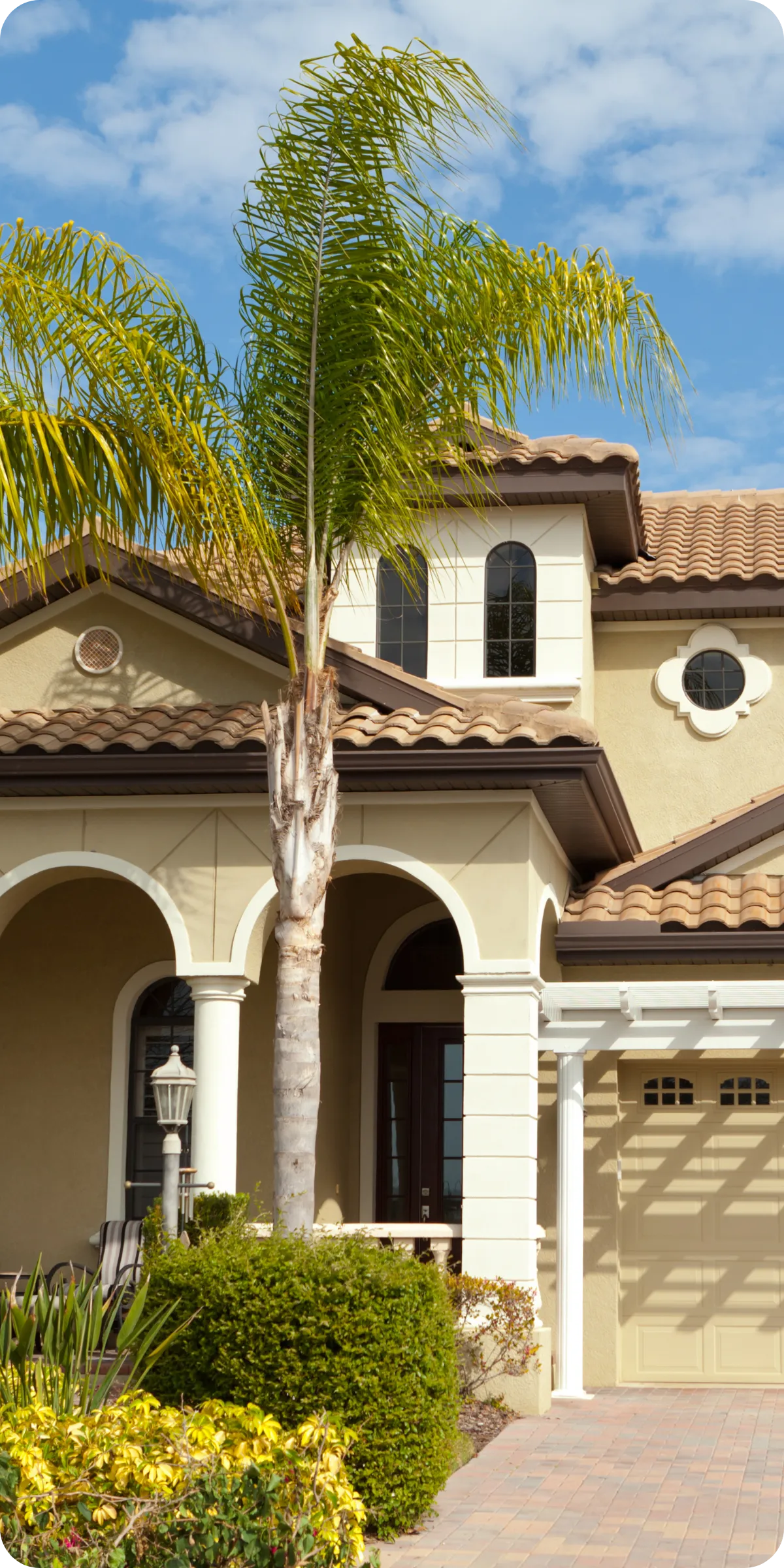 Front view of a well-kept Orlando, FL home with palm trees — symbolizing trust and quality in professional home inspections by A.C.F. Home Inspections.