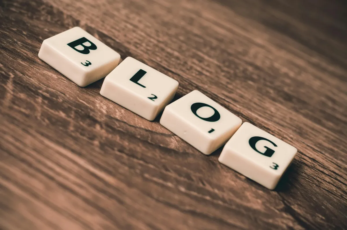 Professional working on a blog for a business using a laptop