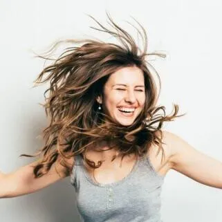 Happy woman with renewed energy from Bioidentical Hormone Replacement Therapy (BHRT) at Hormone Treatment Centers in Overland Park, KS