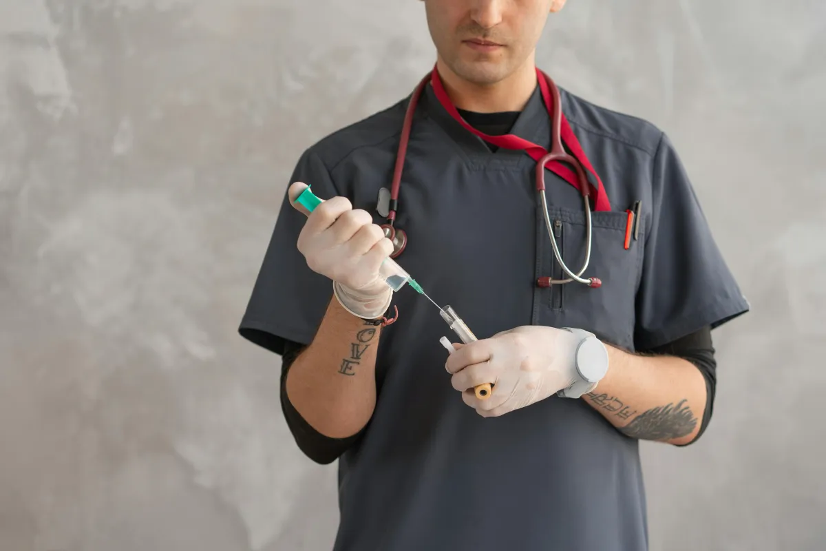 Healthcare provider preparing injection – Low Testosterone (Low T) can cause fatigue, weight gain, mood changes, low libido, and reduced muscle strength. Hormone Treatment Centers in Overland Park, KS offers TRT solutions.