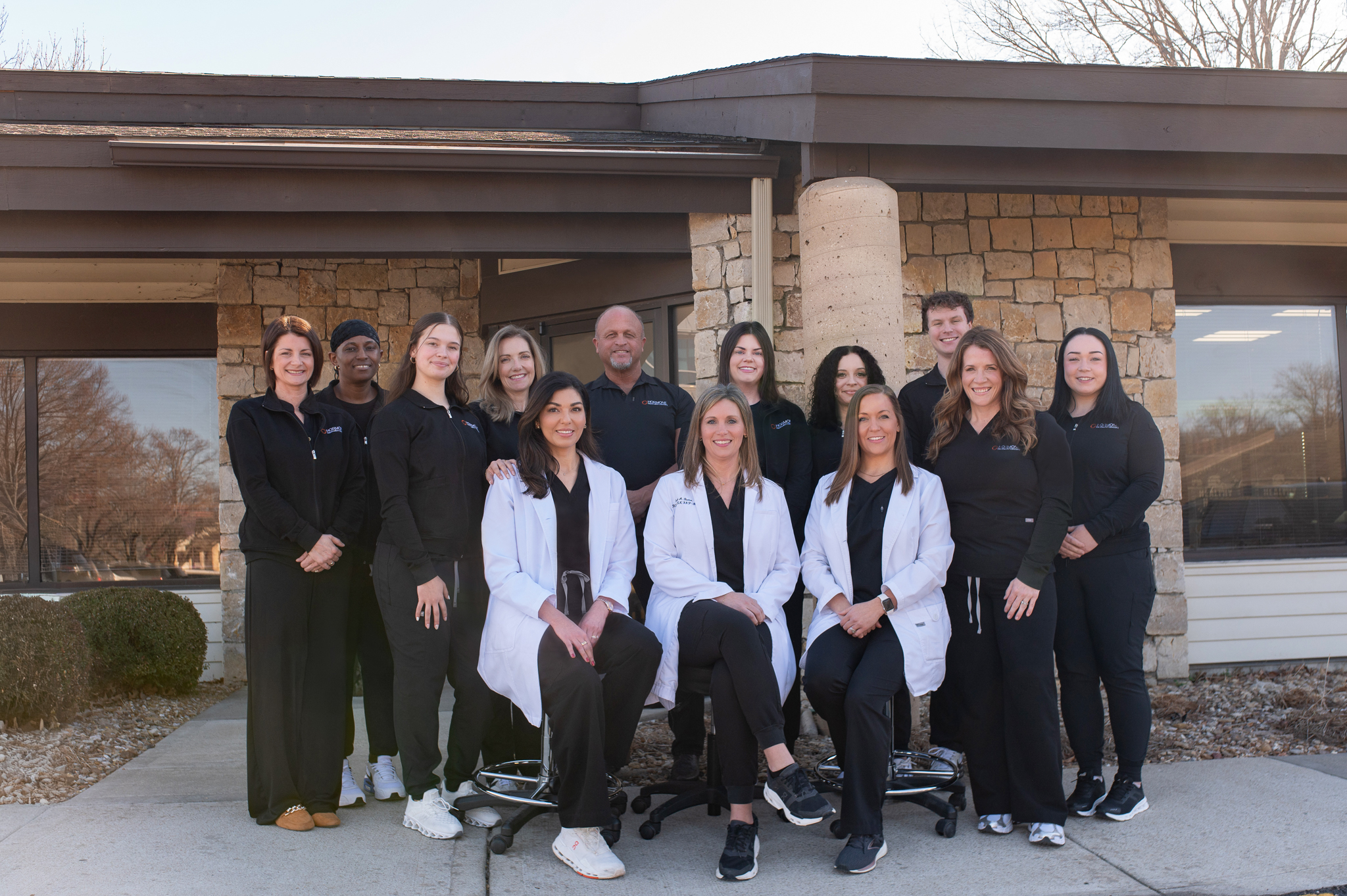 Hormone Treatment Centers of Kansas City medical team smiling in the clinic, representing compassionate and professional hormone therapy care..