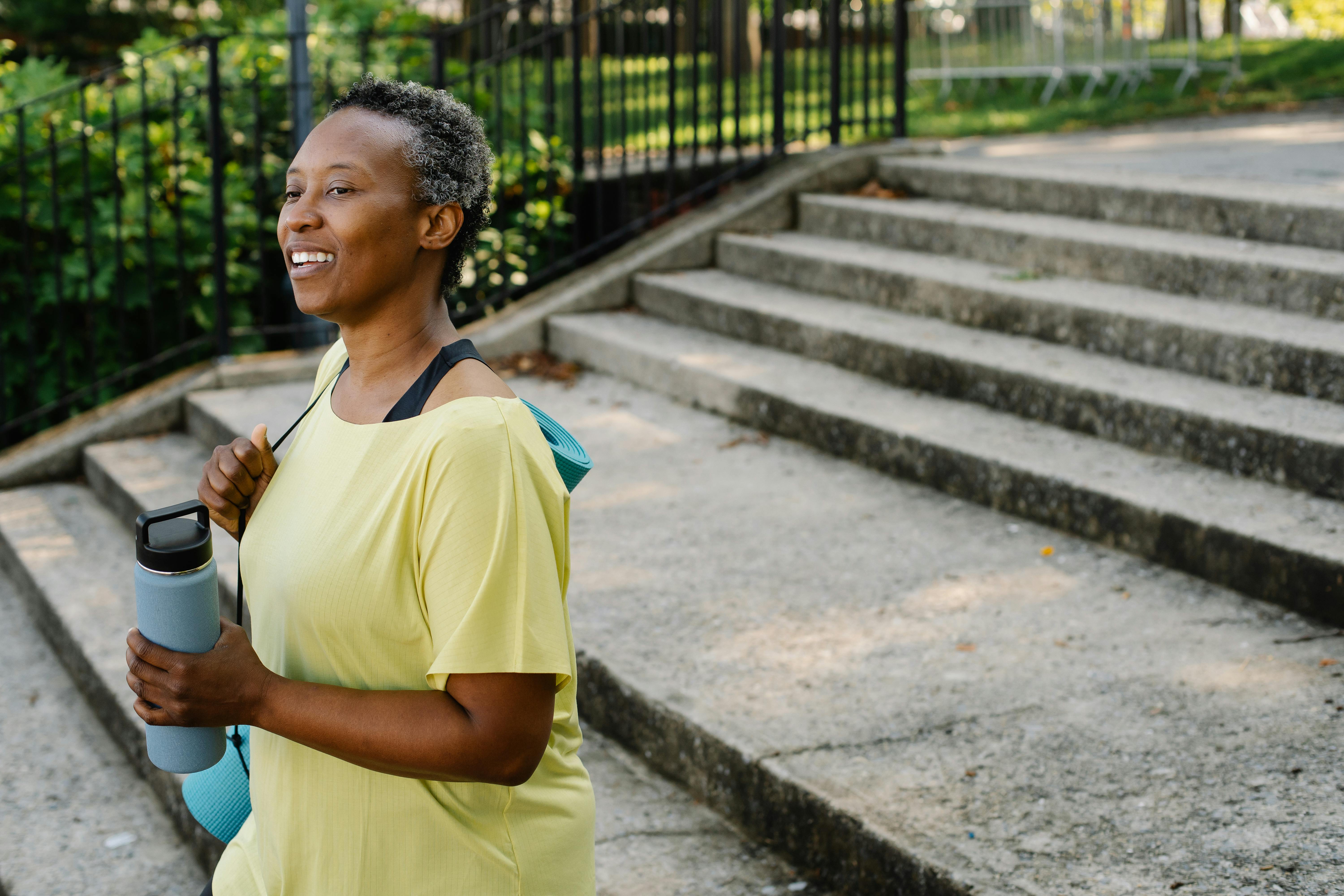 Woman with menopause symptoms like hot flashes and fatigue exploring hormone assessment in Overland Park KS and Lee’s Summit MO