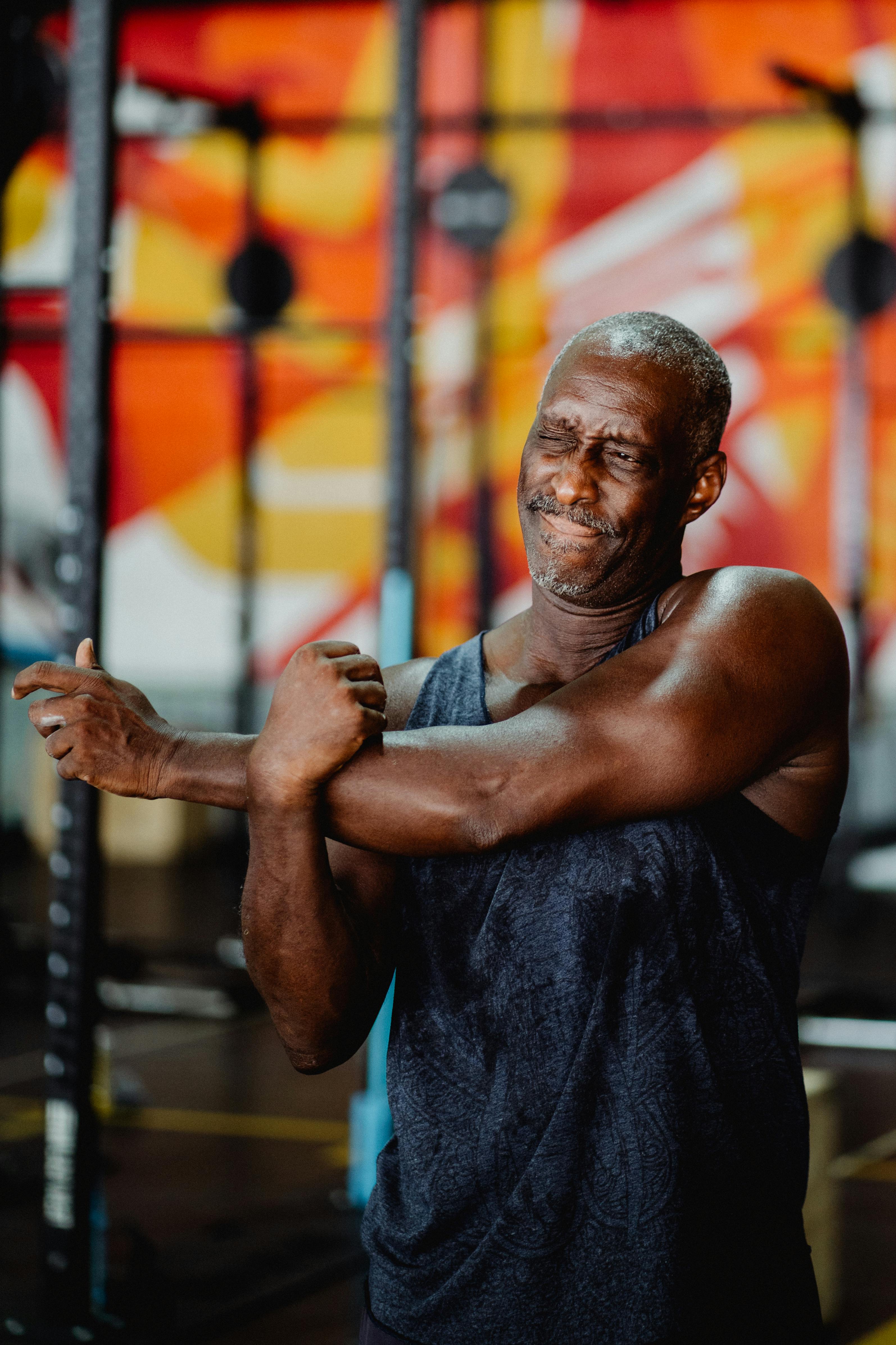 Man stretching after exercise to support recovery and body composition goals with Tesamorelin peptide therapy at Hormone Treatment Centers.