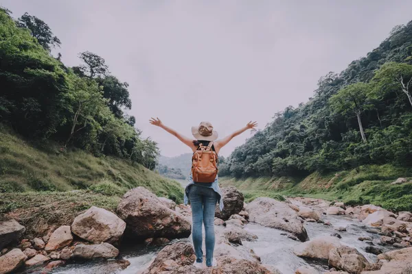 woman standing arms wide open