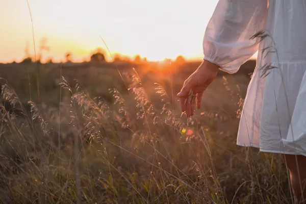 woman in a field finding freedom 