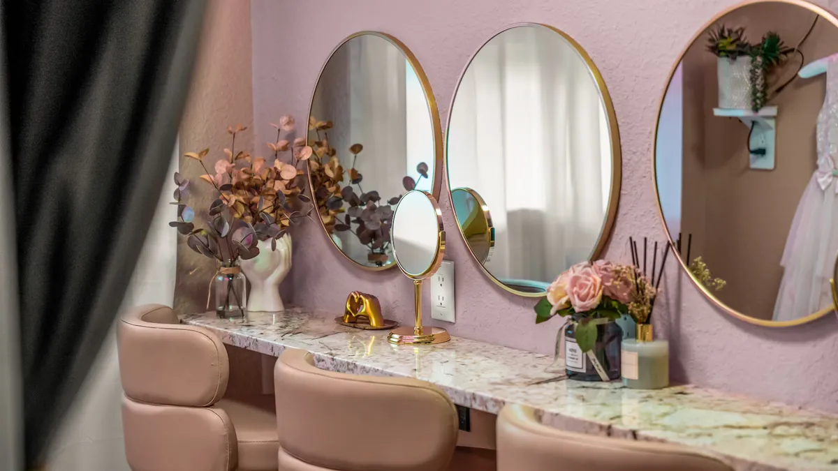 Editorial view of private luxury temple suite with draped organic linen daybed and rainforest garden views