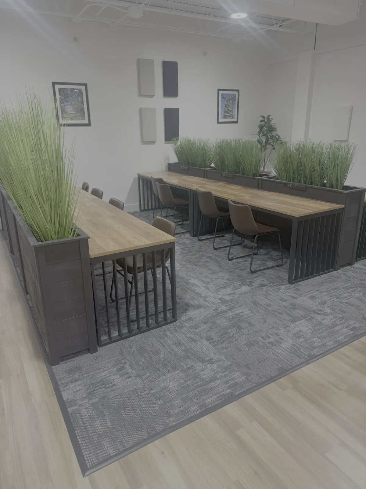 man standing beside another sitting man using computer