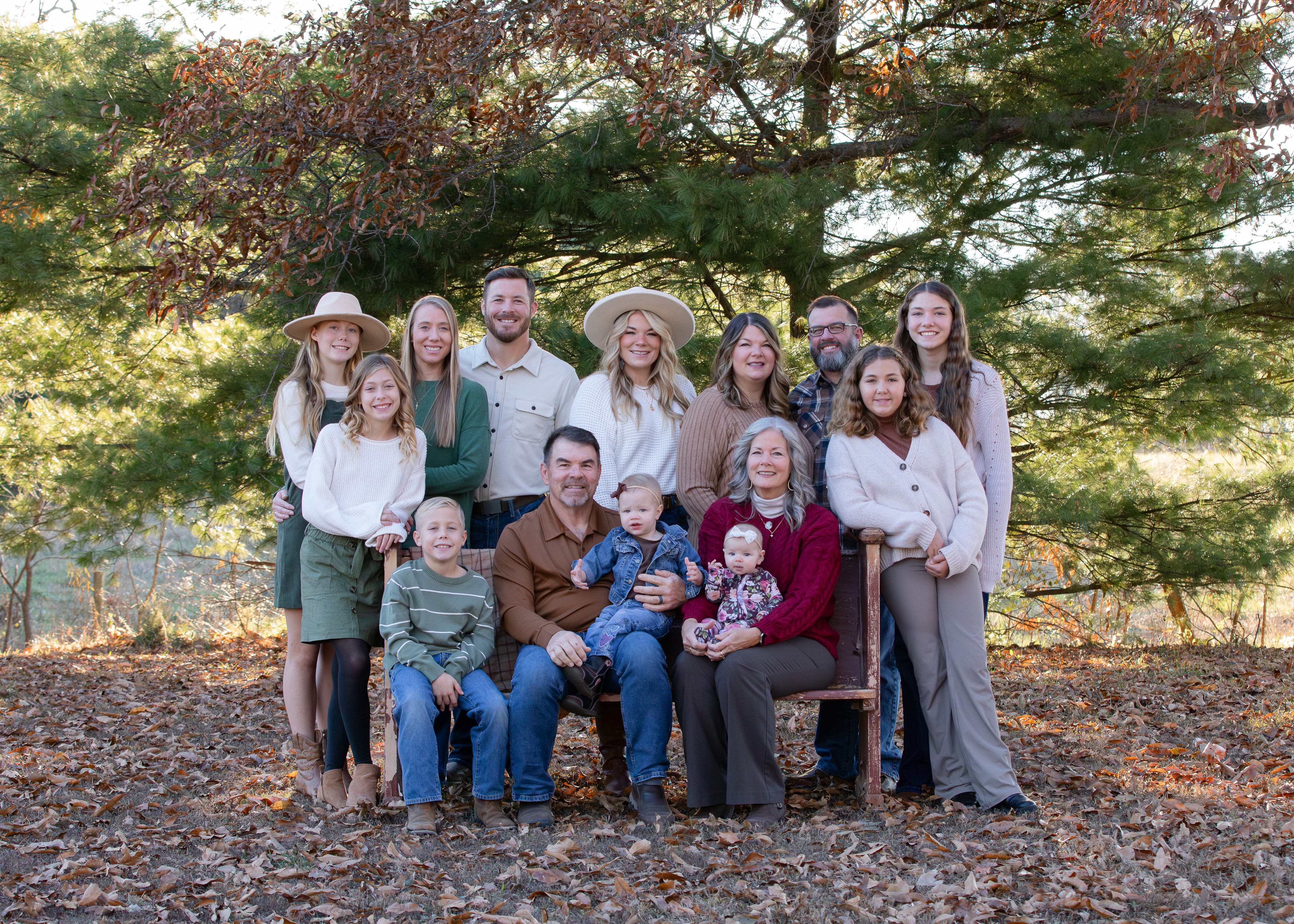 Extended family portrait session outdoors in Illinois during fall with multiple generations