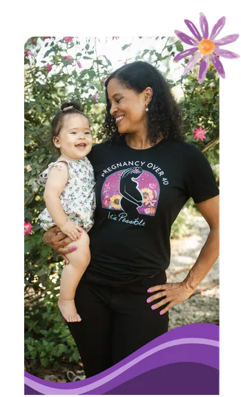 Author holding baby, smiling