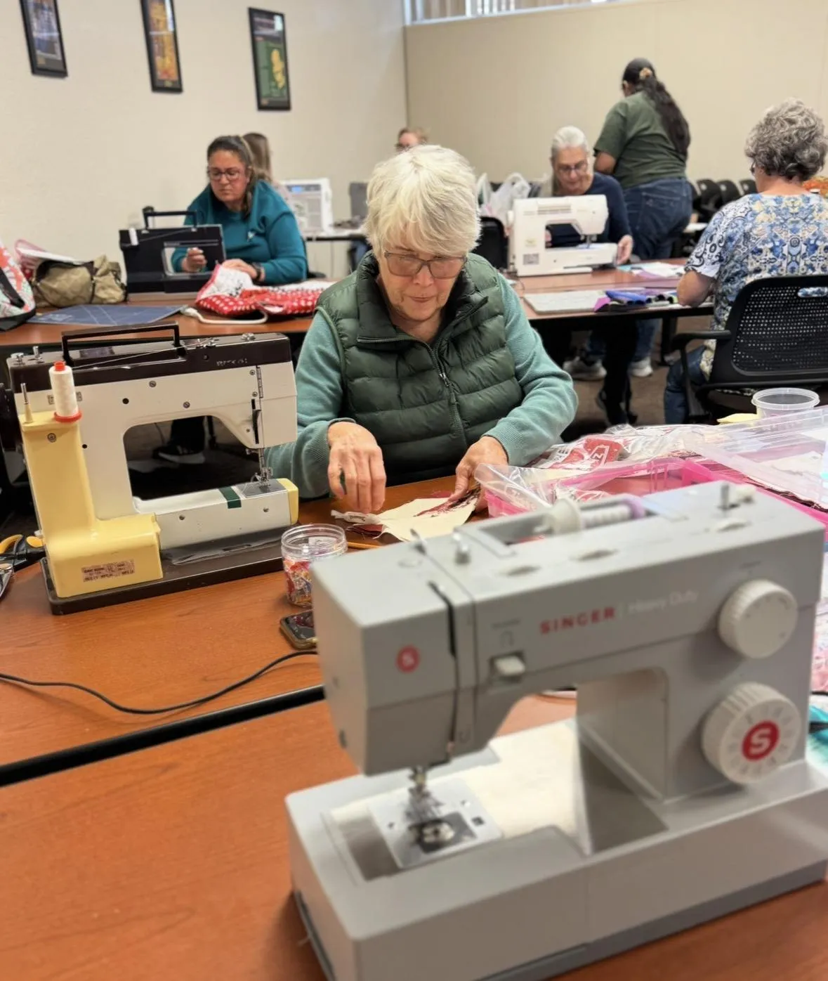 Group of quilters gathering for an in-person workshop in Bakersfield