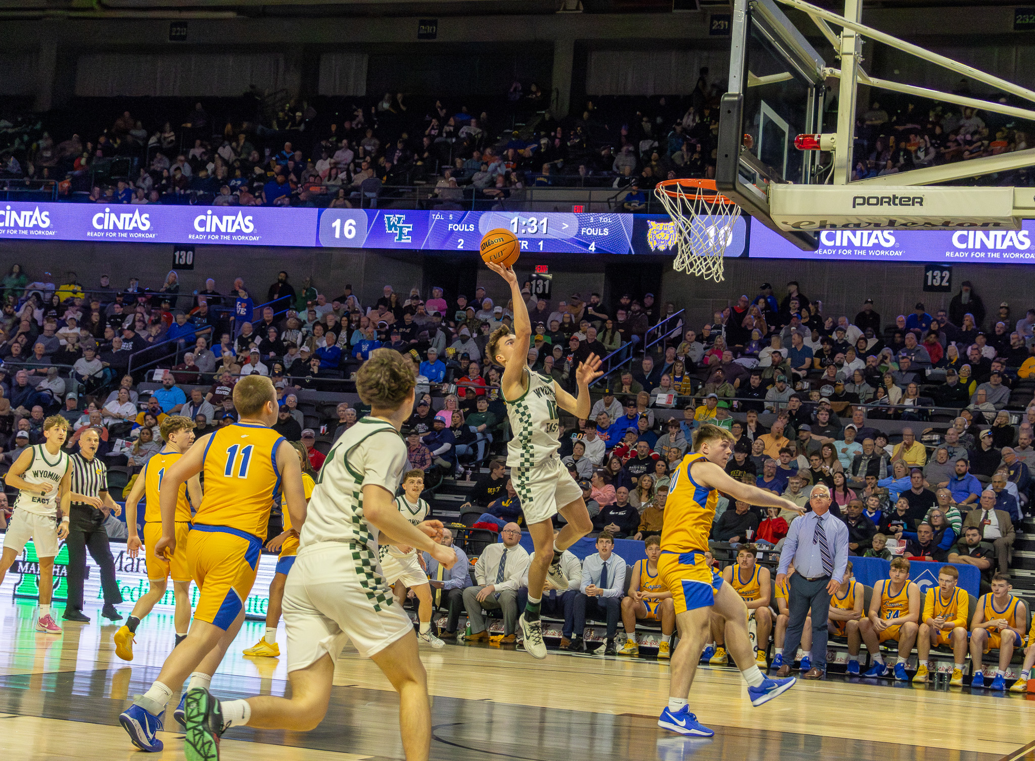 HS Boys Basketball State Tournament: Wyoming rolls past Logan
