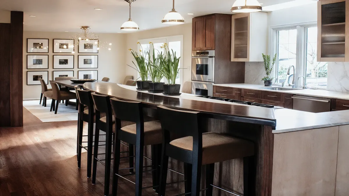 Kitchen with custom arched island, walnut, maple and marble with dining space beyond, Clyde Hill