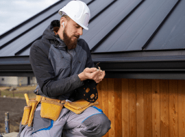 a roofer working on the roof