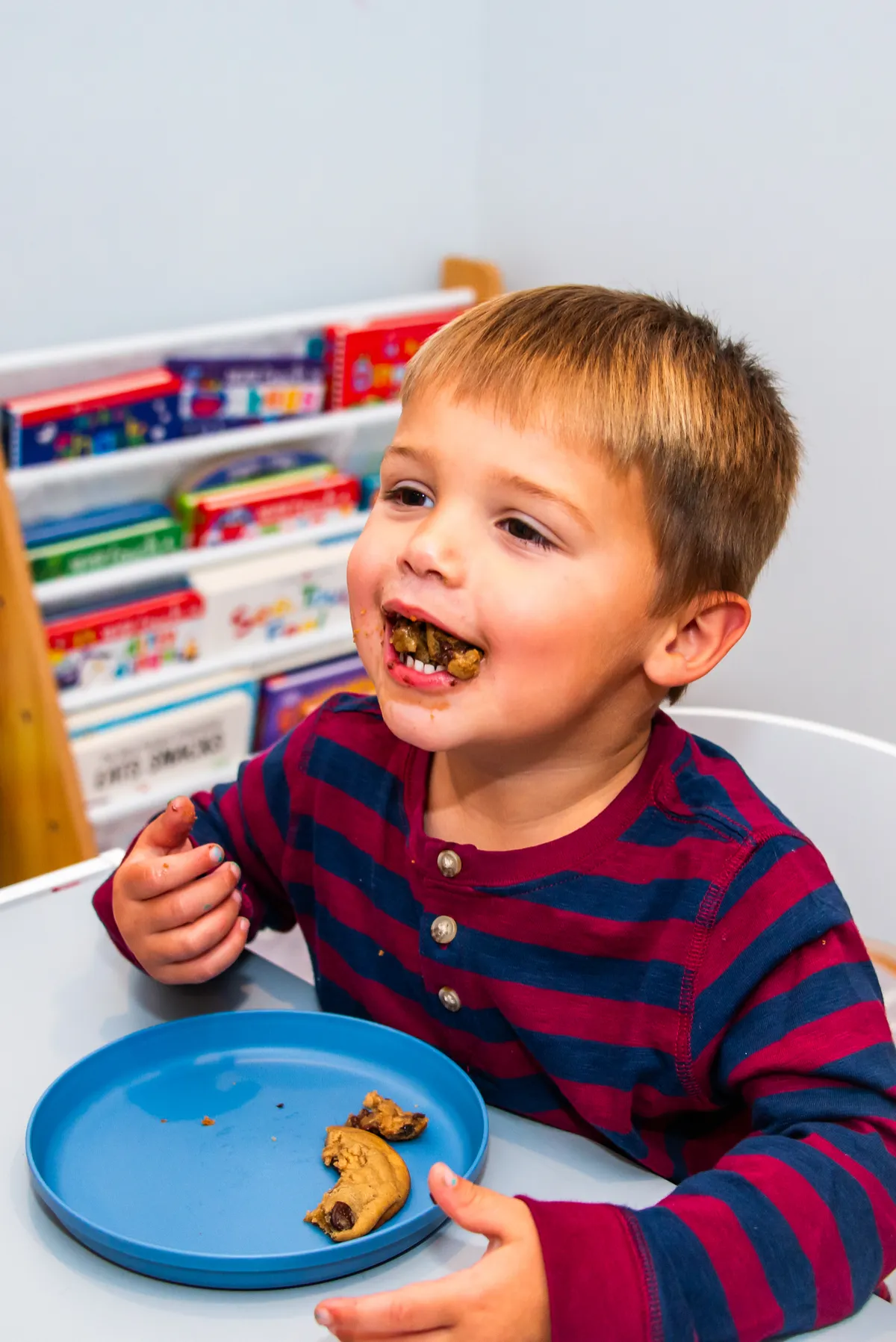 A child enjoying a healthy meal with a pediatric feeding therapist in a sunny kitchen