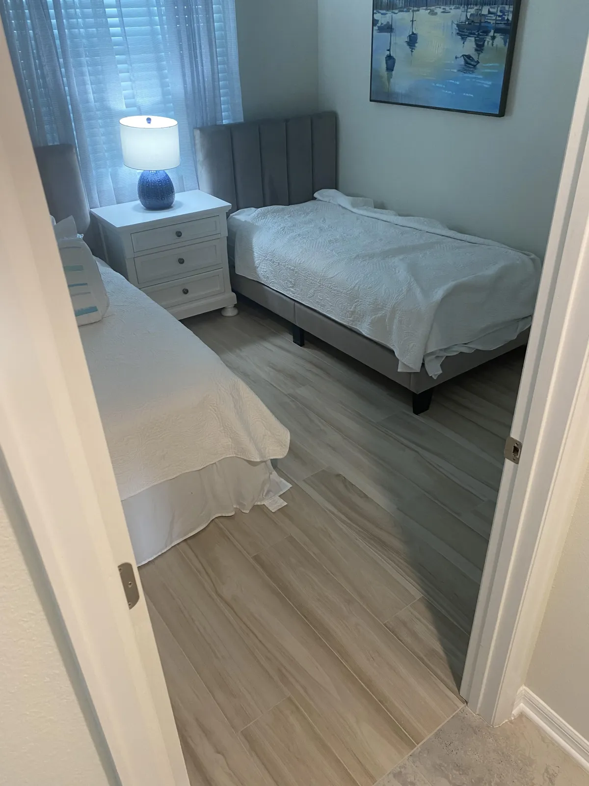 New carpet installation with textured finish in a bedroom