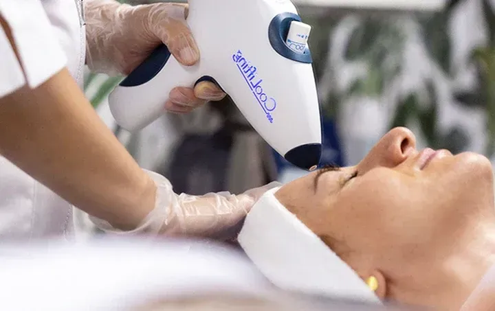 person in white dress shirt wearing green and white hat