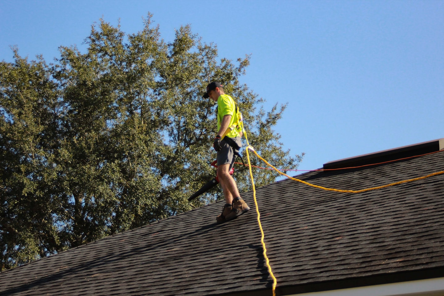 Roofing contractor performing roof repairs