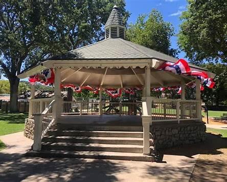 Templeton Community Park in Templeton, California, featuring a historic gazebo, mature oak trees, shaded walkways, and open green spaces that serve as a gathering place for community events and recreation.