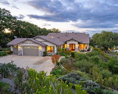 Atascadero, California real estate featuring single-family homes surrounded by mature oak trees, landscaped yards, and rolling Central Coast hills.