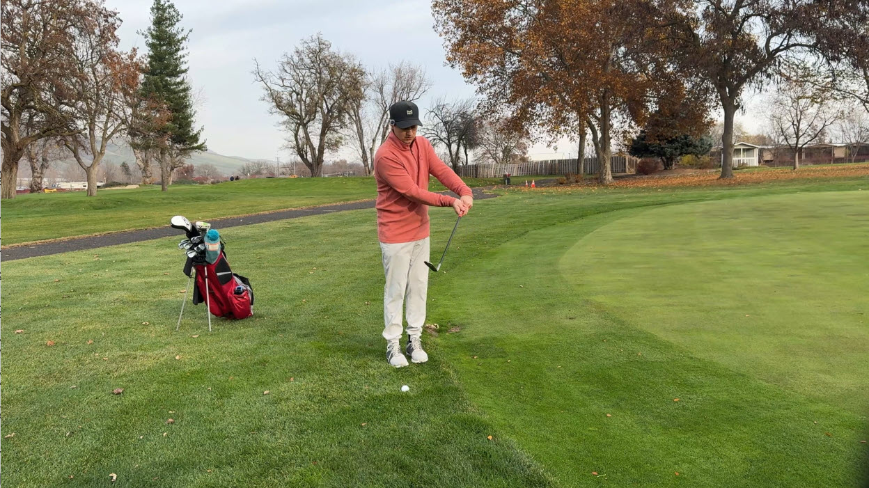 white golf ball near hole